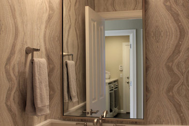 Inspiration for a small transitional light wood floor and multicolored floor powder room remodel in Seattle with shaker cabinets, white cabinets, a one-piece toilet, multicolored walls, an undermount sink and quartz countertops