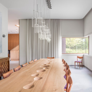 Dining Room with walnut wood hand-carved table that seats up to sixteen