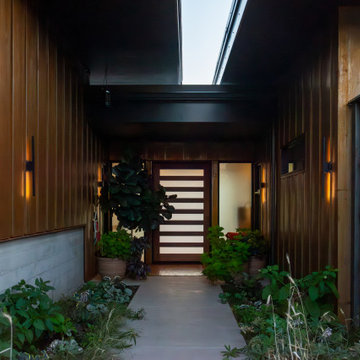 Exterior entry with cor-ten siding
