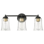 Millennium Lighting - 3 Light 21.75 in. Matte Black Vanity Light - Vintage-inspired, tapered, bell-shaped seedy glass globes give the Abilene Family of vanity lighting an unparalleled design signature rooted in turn-of-the-century American design. Finished in either matte black or cottage white, these fixtures are available in 1-light, 2-light, and 3-light options and are further embellished with stylish brushed gold sockets.