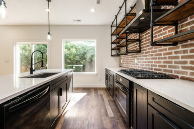 Kitchen - industrial kitchen idea in Boise