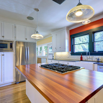 Delightful Contemporary Kitchen with Wood Island Top by DeVos Woodworking