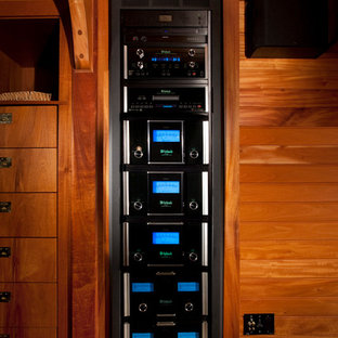 Example of an eclectic carpeted home theater design in Portland Maine with a projector screen