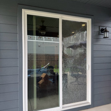 Before — shattered tempered glass on a residential patio sliding door in the Por