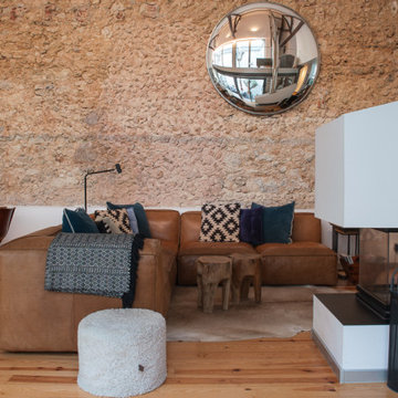 Marvila living room with sectional sofa, stone and mirror