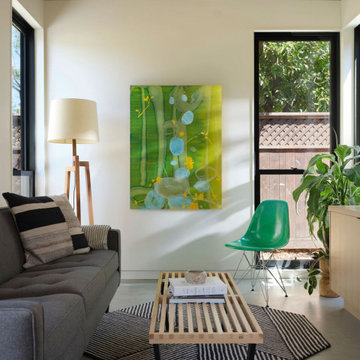 Warm Modern ADU Living Room with Vaulted Ceiling and Floor-to-Ceiling Windows
