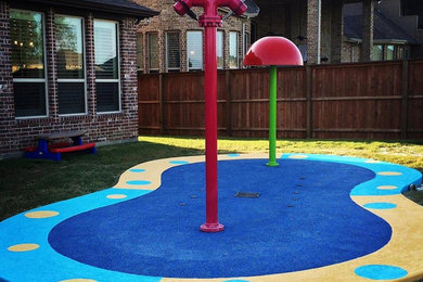 Inspiration for a mid-sized backyard pool fountain remodel in Dallas