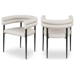 Meridian Furniture - Lavina Upholstered Dining Chair, Taupe, Vegan Leather, Set of 2 - Experience the sophisticated allure of the Lavina taupe vegan leather dining chair. This chair features a matte black finish and an iron metal frame, ensuring both durability and a modern edge. The contemporary design and luxurious vegan leather elevate your dining space with effortless elegance, making it the perfect centerpiece for gatherings. Enhance your dining area where classic elegance meets contemporary flair.