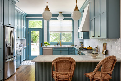 Eat-in kitchen - large transitional eat-in kitchen idea in DC Metro with shaker cabinets, blue cabinets, marble countertops and white backsplash