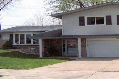 Mid-sized traditional white two-story mixed siding exterior home idea in Chicago