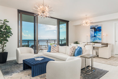 Inspiration for a large modern open concept beige floor and porcelain tile living room remodel in Tampa with white walls