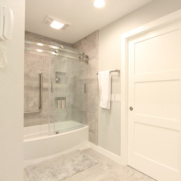 Tiled Tub Surround with Curved Glass Sliding Doors