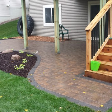 Patio in Shakopee under a deck