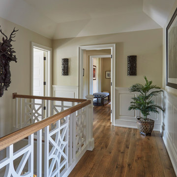 Open Staircase with White Paneled Wainscoting