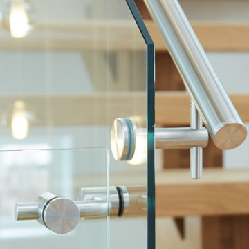 white oak mono stringer with stainless steel hand rail