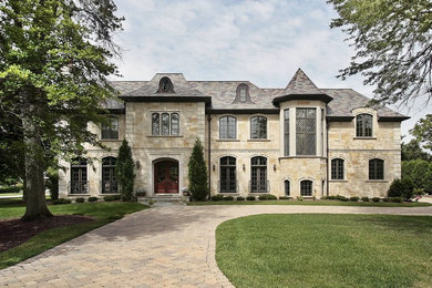 Three-story exterior home idea in Minneapolis with a tile roof