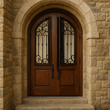 Mediterranean Arched Entry with Custom Wrought Iron & Stone Surround