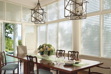 Example of a large transitional great room design in New York with white walls and no fireplace