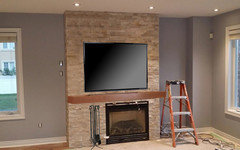 TV is a bit wider than the fireplace