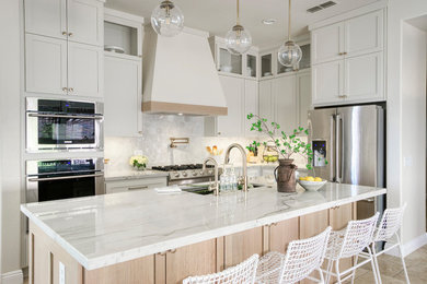 Inspiration for a transitional limestone floor kitchen remodel in Phoenix with shaker cabinets, quartzite countertops and stone tile backsplash