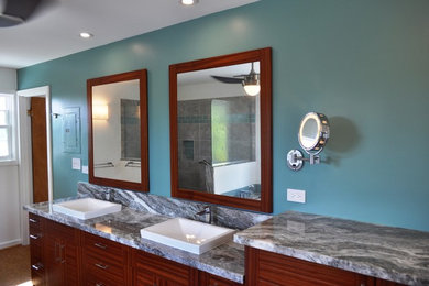 Bathroom - mid-sized contemporary master vinyl floor bathroom idea in Dallas with flat-panel cabinets, medium tone wood cabinets, a one-piece toilet, a drop-in sink, marble countertops and gray countertops
