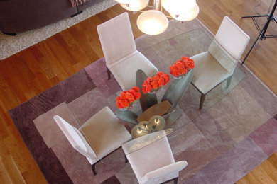 Large trendy dark wood floor great room photo in Milwaukee with beige walls and no fireplace