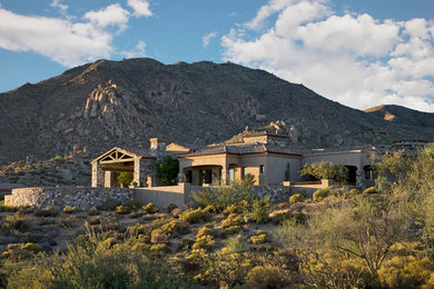 Example of a tuscan exterior home design in Phoenix