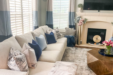 Inspiration for an open concept living room remodel with gray walls and a wall-mounted tv