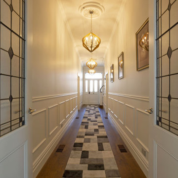 Traditional Hallway with Panelling and Feature Doors