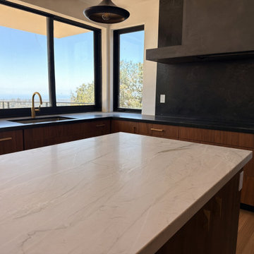Cream Quartzite Waterfall Island with Black Stone Perimeter