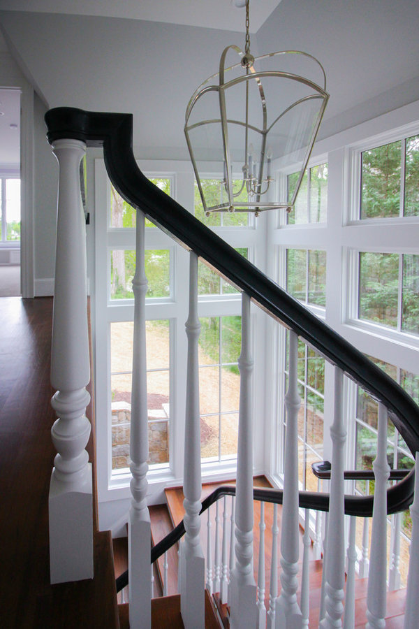 Powerful Impression by Floating Staircase in Suburban Foyer