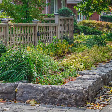 Armour Stone accents this Front Yard's Design