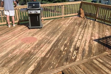 Mid-sized elegant backyard deck photo in Charlotte