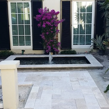 Formal Koi Pond with natural stone walkway and border