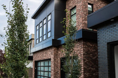Example of an exterior home design in Calgary