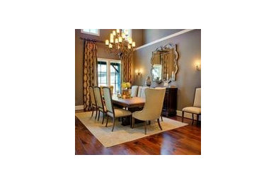 Example of an eclectic dining room design in Houston