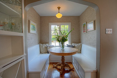Enclosed kitchen - mid-sized craftsman l-shaped medium tone wood floor enclosed kitchen idea in Seattle with a farmhouse sink, shaker cabinets, white cabinets, quartz countertops, gray backsplash, ceramic backsplash, stainless steel appliances and no island