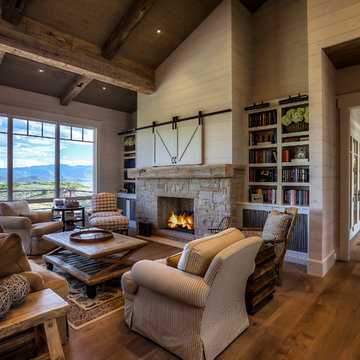 Living Room With Exposed Beams And Floor To Ceiling Windows
