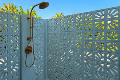 Inspiration for a mid-sized 1960s backyard tile natural pool landscaping remodel in Los Angeles