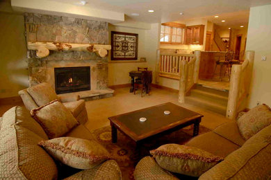 This is an example of a mid-sized country formal enclosed living room in Denver with beige walls, carpet, a standard fireplace, a stone fireplace surround and no tv.
