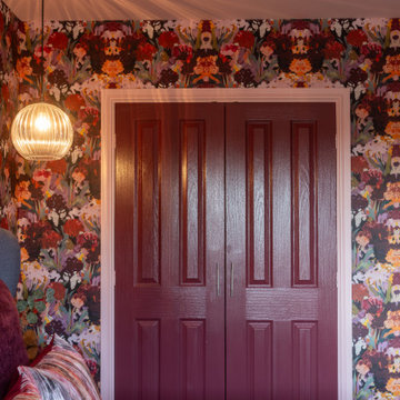 Maximalist bedroom with pendant and built-in wardrobe