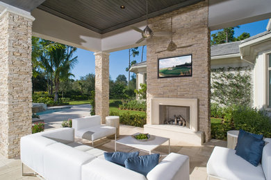 Patio - large coastal backyard stone patio idea in San Francisco with a gazebo