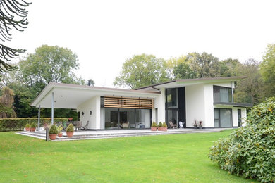 Modern zinc roof house surrounded by a bluebell woodland in Medstead