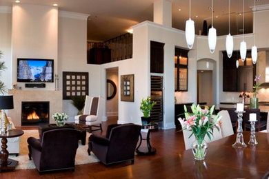 Example of a mid-sized trendy open concept dark wood floor and beige floor family room design in Seattle with beige walls, a standard fireplace and a stone fireplace