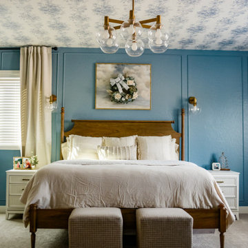 Bedroom interior with wallpapered ceiling