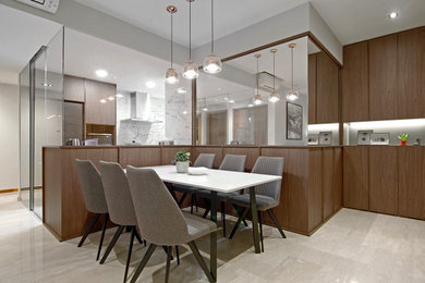Photo of a large contemporary kitchen/dining combo in Singapore with white walls and grey floor.