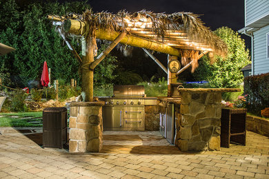 Example of an island style patio design in New York