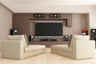 Example of a large trendy open concept laminate floor and beige floor living room design in San Diego with gray walls, no fireplace and a wall-mounted tv