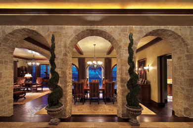 Great room - mediterranean dark wood floor great room idea in Orange County with beige walls