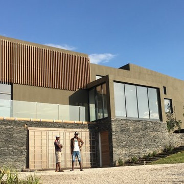 arrival view - drive, garage & ceremonial stairway